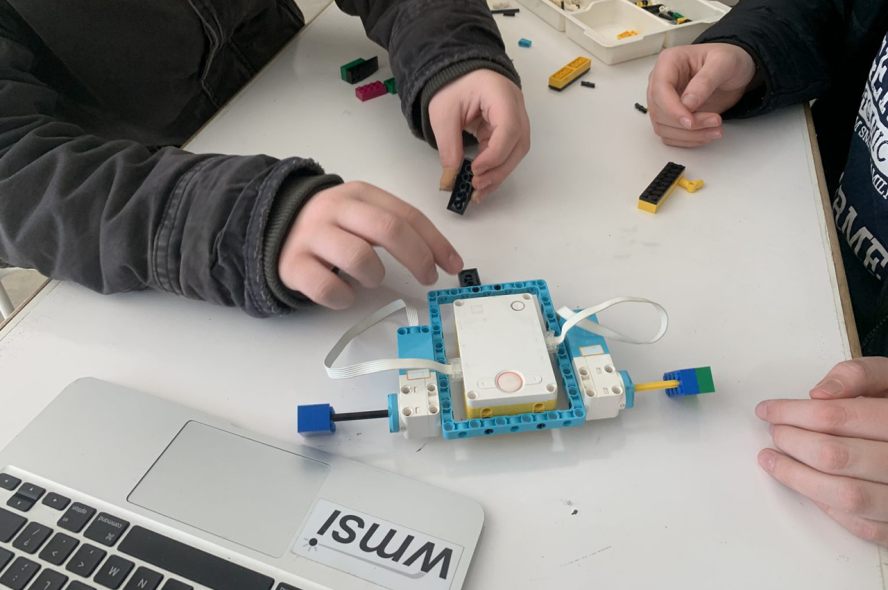 Students build a device with LEGO robotics