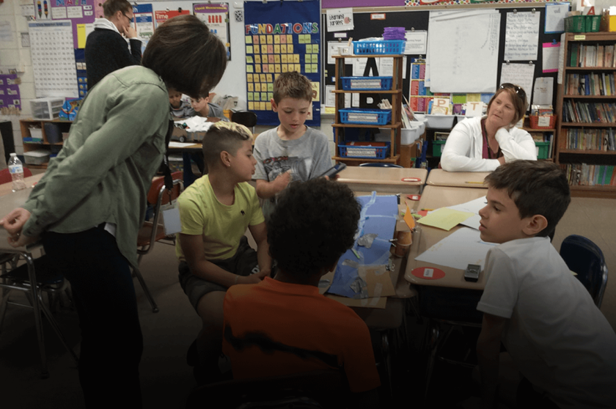 Teacher working with Students 