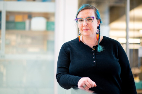 Kat Allen poses for a photo in the robotics lab.